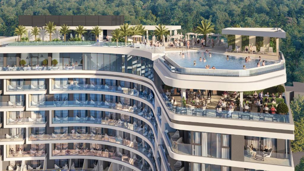 uma vista aérea de um edifício de apartamentos com piscina em GRIFID Noa - Premium Ultra All Inclusive em Golden Sands