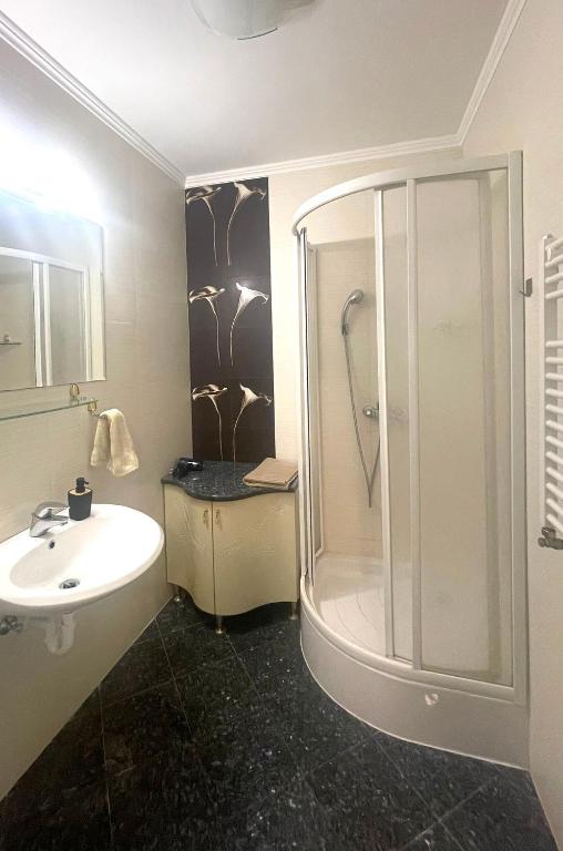 Koupelna v ubytování Club218 Holiday Apartman Siófok