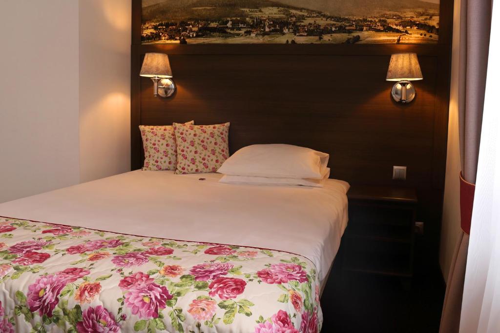 Posteľ alebo postele v izbe v ubytovaní Hotel Buczyński Medical & SPA