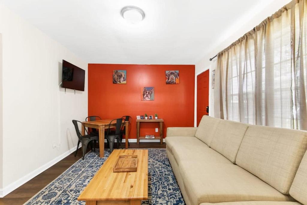 a living room with a couch and a table at The Bricks - Apt 2 in Birmingham