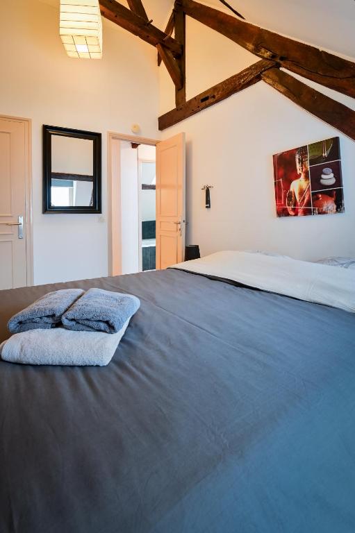 Posteľ alebo postele v izbe v ubytovaní Le duplex de Lise