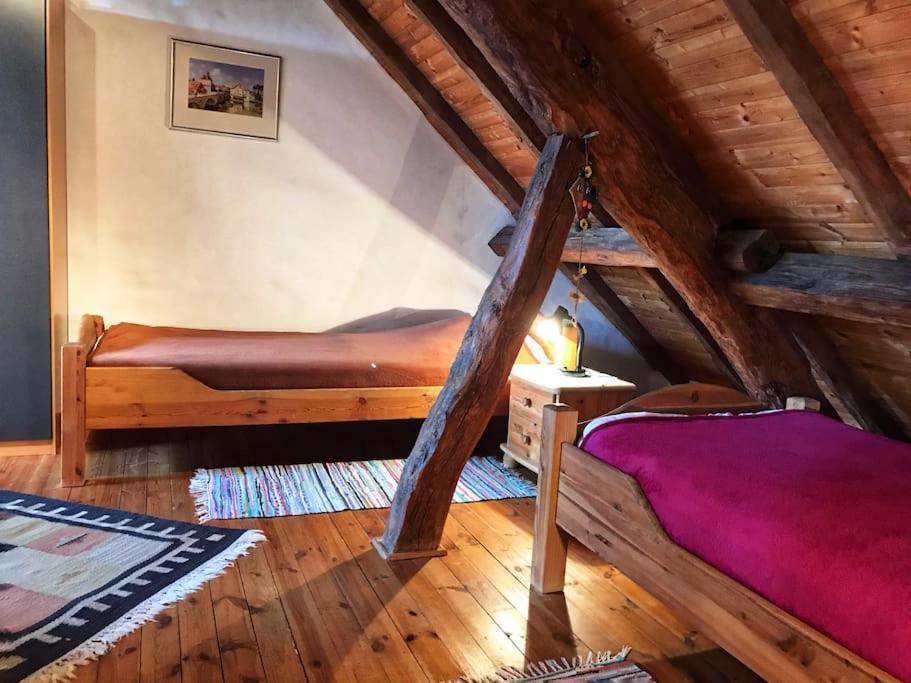 Postel nebo postele na pokoji v ubytování Obergeschosswohnung mit Ausblick