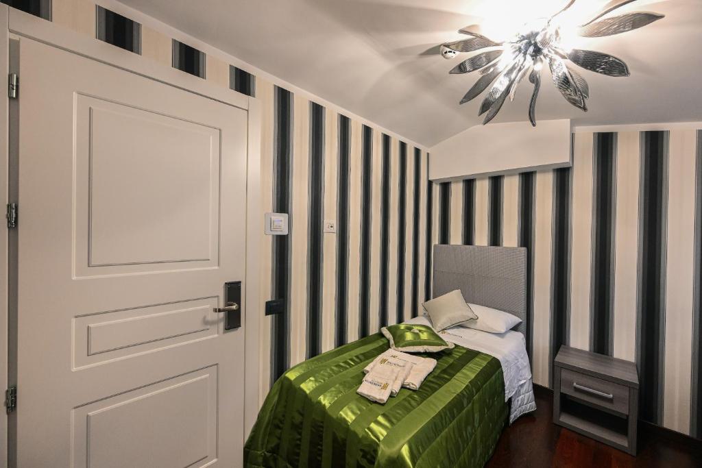 Postel nebo postele na pokoji v ubytování Hotel Mastrodattia
