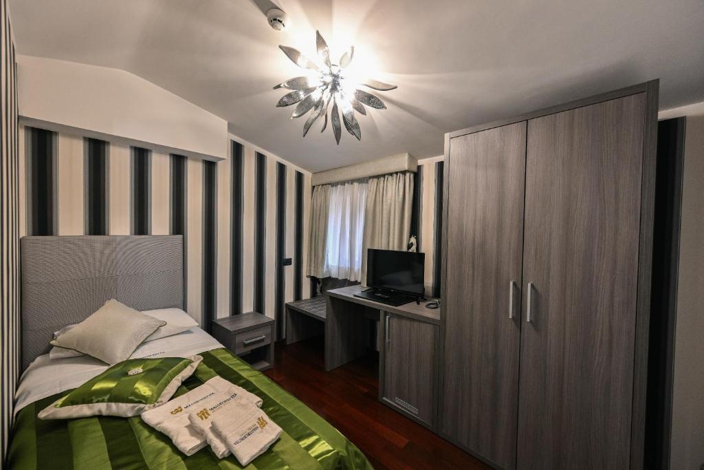 Postel nebo postele na pokoji v ubytování Hotel Mastrodattia