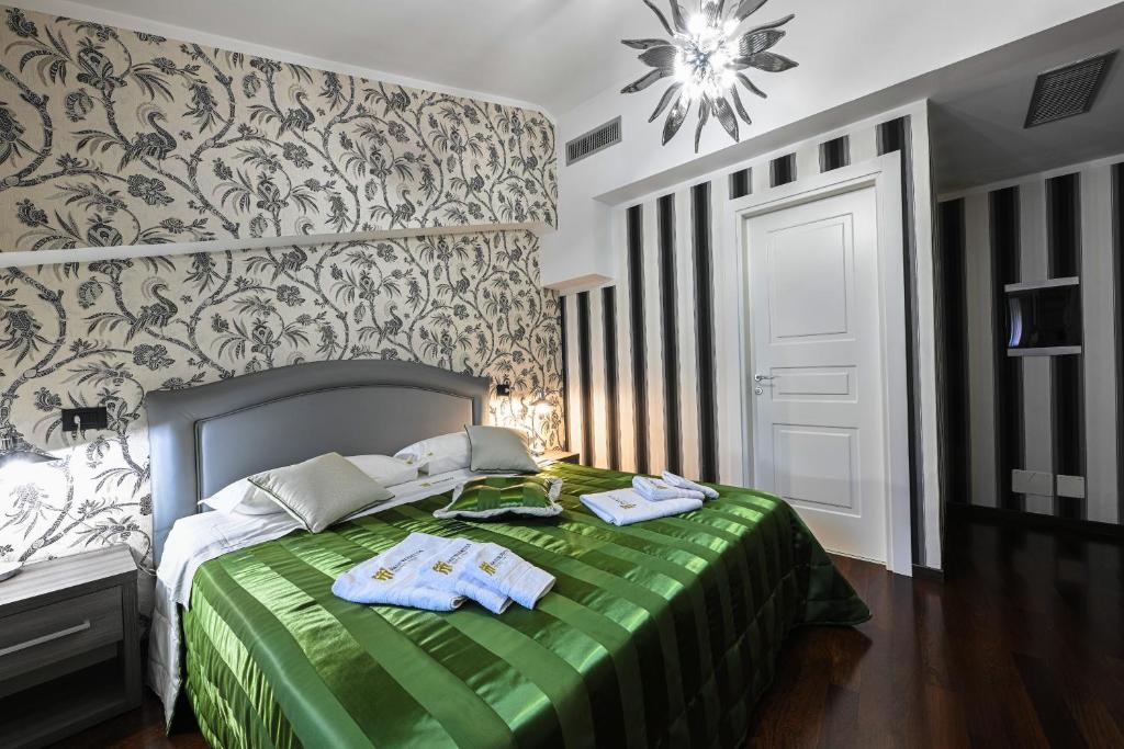 Postel nebo postele na pokoji v ubytování Hotel Mastrodattia