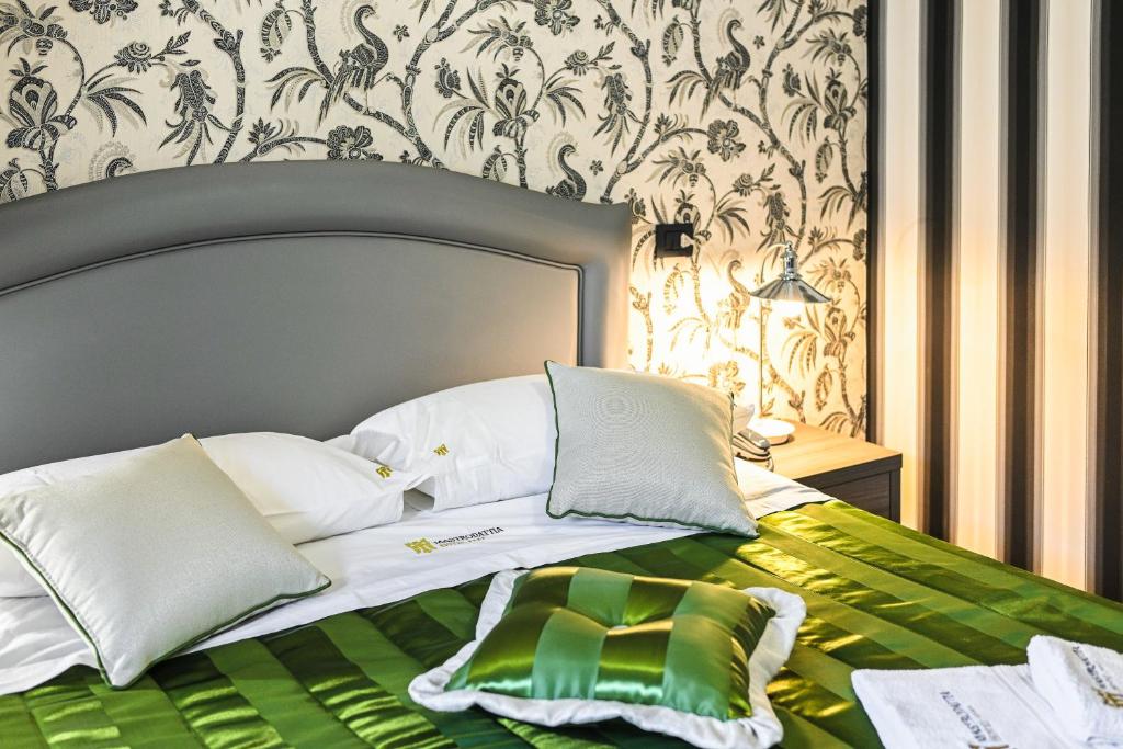 Postel nebo postele na pokoji v ubytování Hotel Mastrodattia