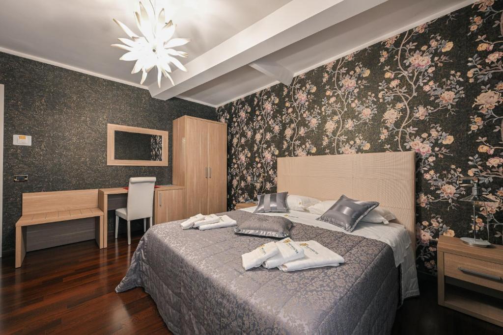 Postel nebo postele na pokoji v ubytování Hotel Mastrodattia