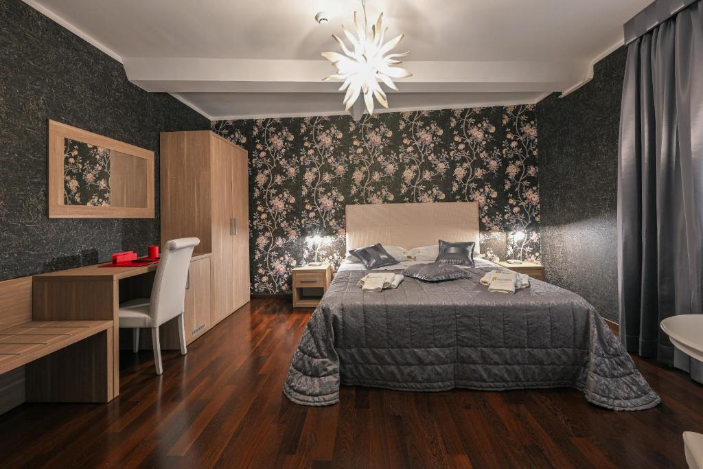 Postel nebo postele na pokoji v ubytování Hotel Mastrodattia