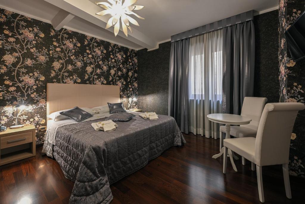 Postel nebo postele na pokoji v ubytování Hotel Mastrodattia