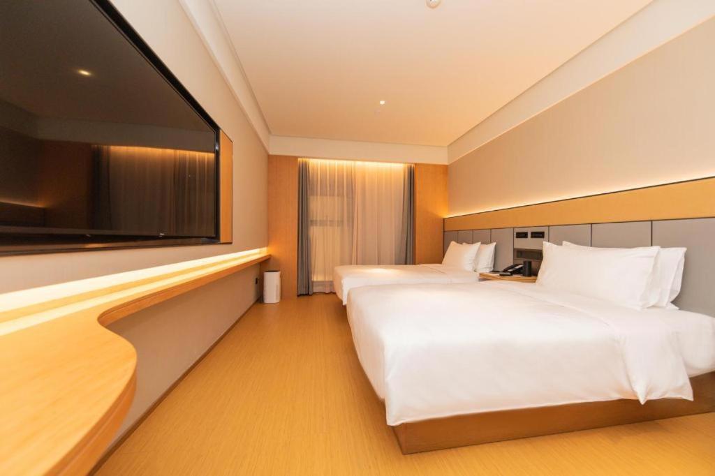 Voodi või voodid majutusasutuse Ji Hotel Shanghai North Bund Changyang Road toas
