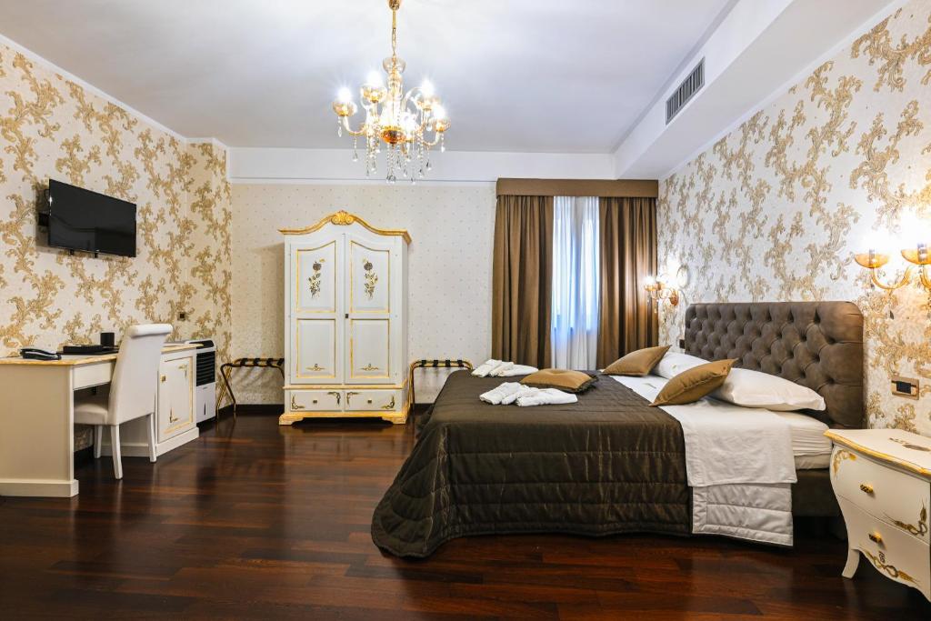 Postel nebo postele na pokoji v ubytování Hotel Mastrodattia