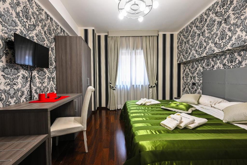 Postel nebo postele na pokoji v ubytování Hotel Mastrodattia