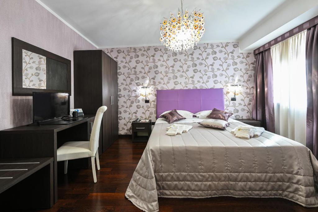 Postel nebo postele na pokoji v ubytování Hotel Mastrodattia