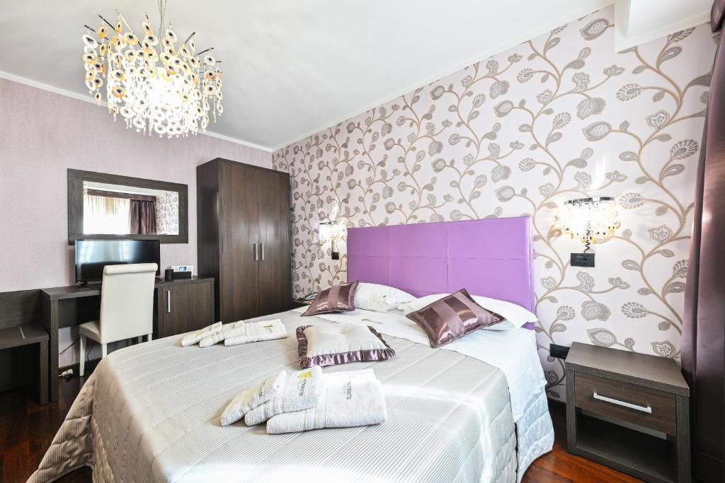 Postel nebo postele na pokoji v ubytování Hotel Mastrodattia