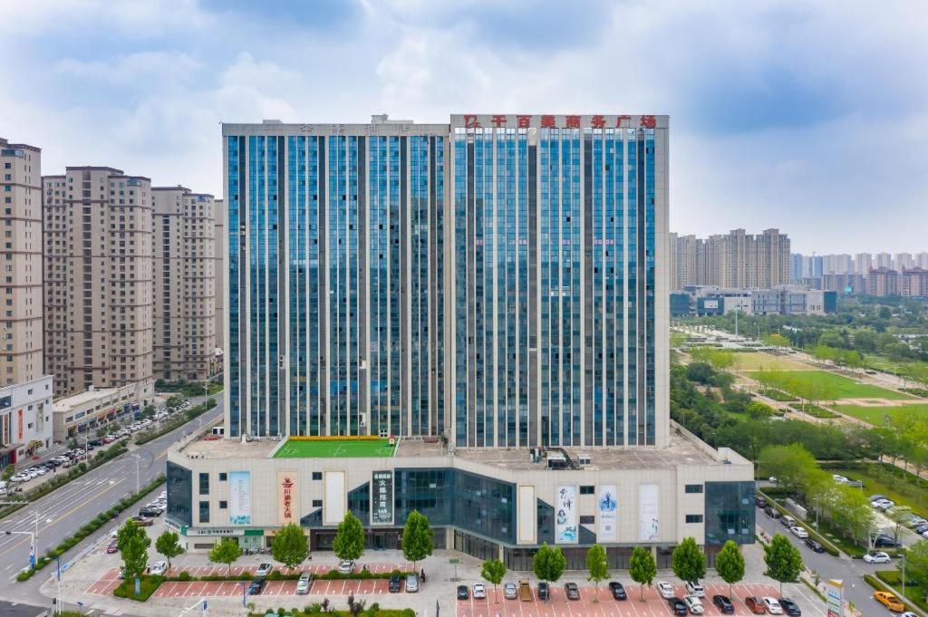 an overhead view of a large building in a city at Ji Hotel Suqian Sucheng District Government in Suqian