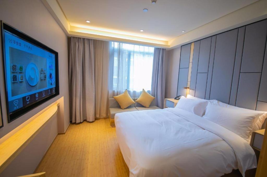 Un ou plusieurs lits dans un hébergement de l'établissement JI Hotel Nanjing Confucius Temple Metro Station