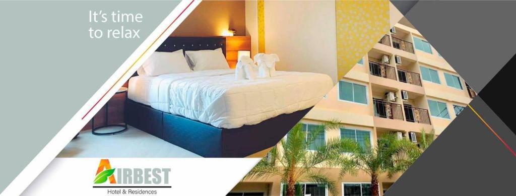 una imagen de una habitación de hotel con una cama y un edificio en AIRBEST HOTEL, en Ban Chang
