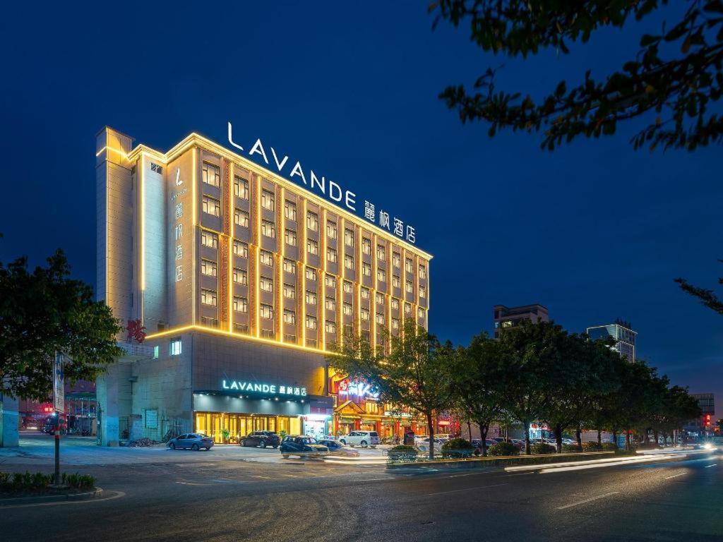 a large building with a sign on it at night at Lavande Hotel Jieyang Danpu in Jieyang