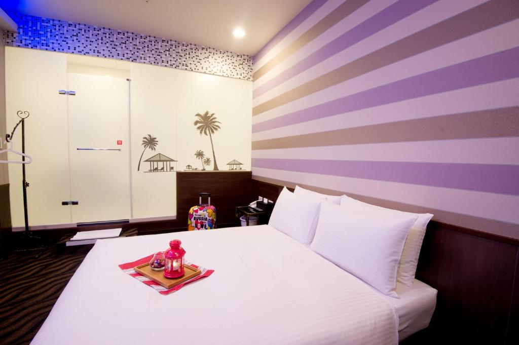 Postel nebo postele na pokoji v ubytování Moshamanla Hotel - Ximen