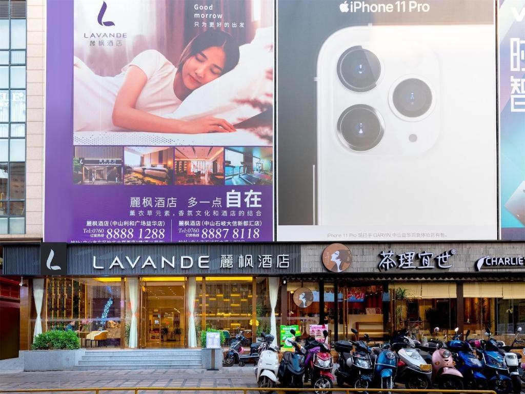 a large billboard on the side of a building with motorcycles at Lavande Hotel Zhongshan Lihe Square in Zhongshan
