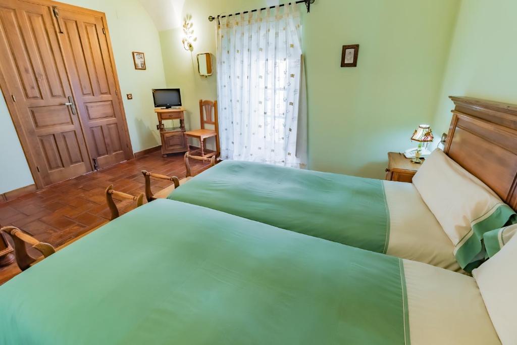 Posteľ alebo postele v izbe v ubytovaní Hotel Rural La Sinforosa