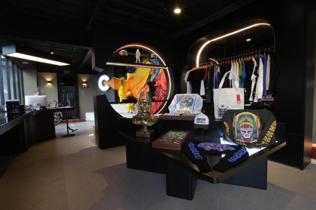 a store with a display of bags and purses at Creative RestArt Hotel By Damn I love Indonesia in Bandung