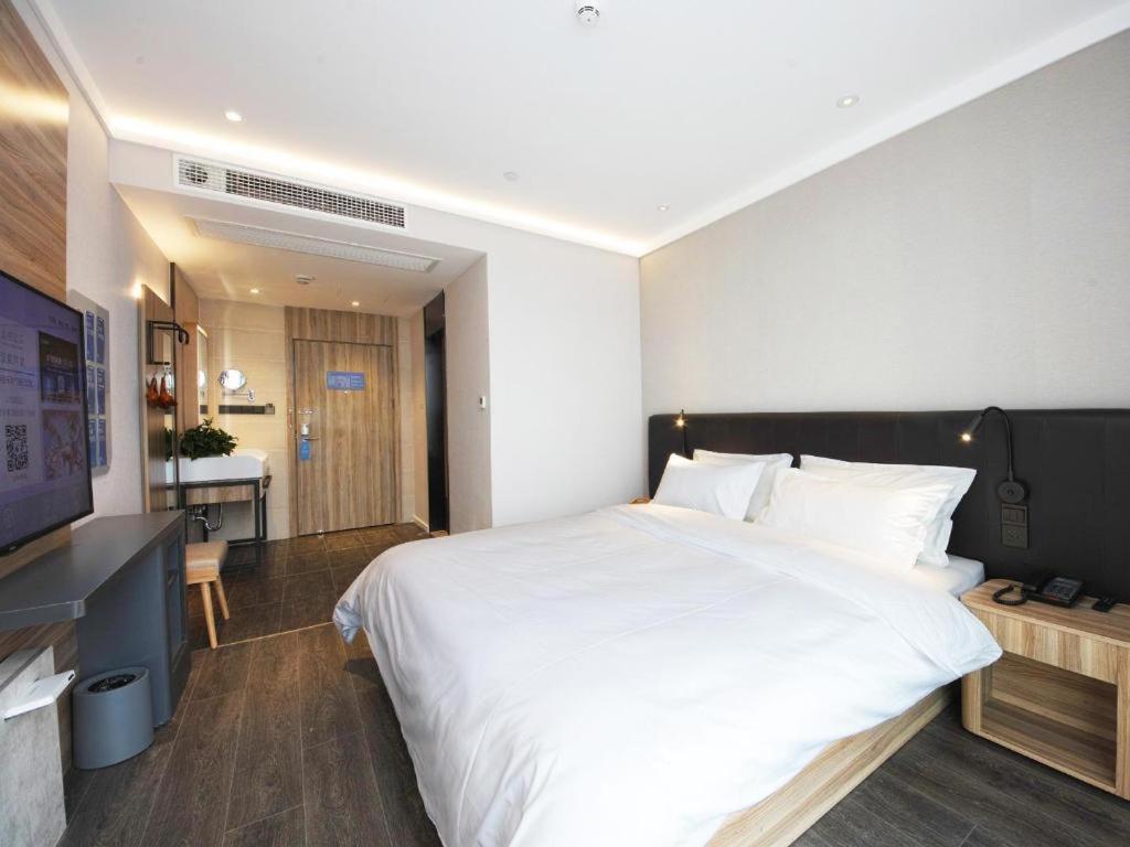 Cama o camas de una habitación en Hanting Premium Hotel Hefei South Railway Station North Square