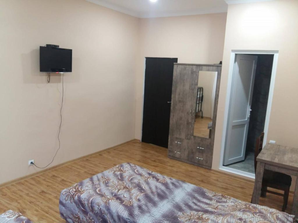 Postel nebo postele na pokoji v ubytování Luiza Lomidze