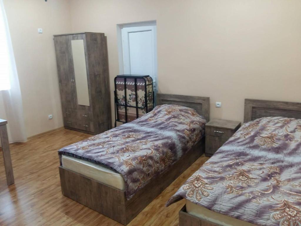 Postel nebo postele na pokoji v ubytování Luiza Lomidze