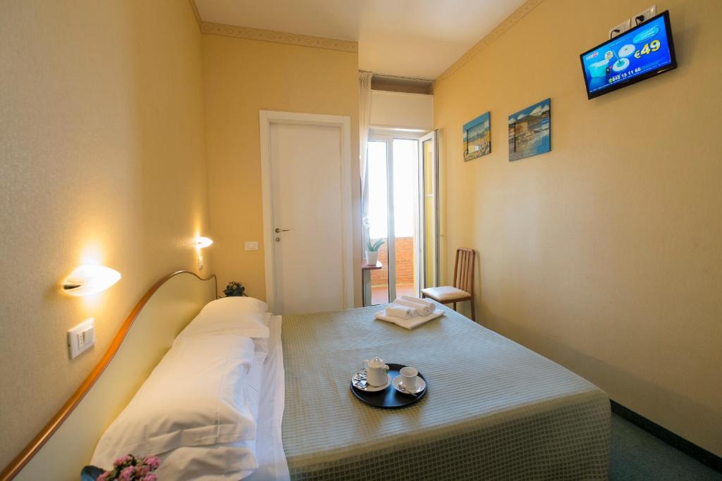Postel nebo postele na pokoji v ubytování Hotel Crosal