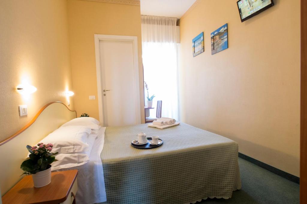 Postel nebo postele na pokoji v ubytování Hotel Crosal