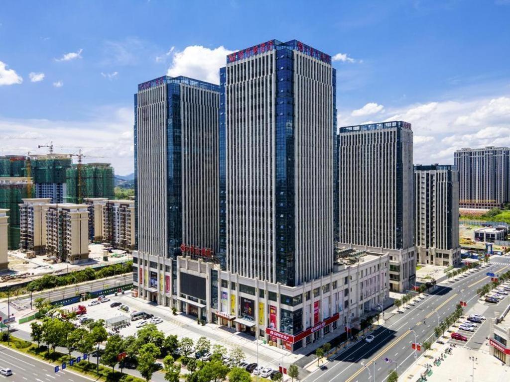 an aerial view of a city with tall buildings at Vienna Hotel Jiangxi Shangrao High-Speed Railway Station in Shangrao