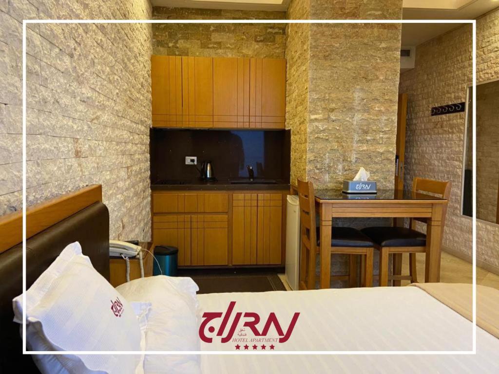 Postel nebo postele na pokoji v ubytování Raj Hotel
