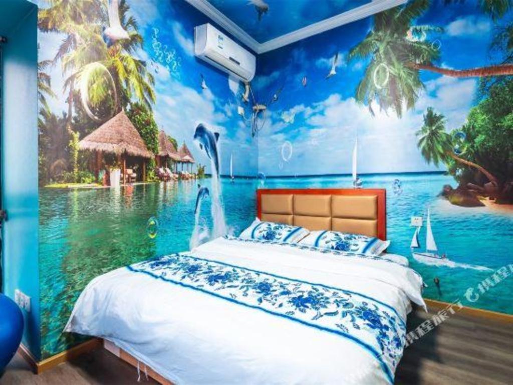 a bedroom with a mural of a resort at JTOUR Inn Wuhan Optics Valley Plaza Pedestrian Street Metro Station in Liufangling