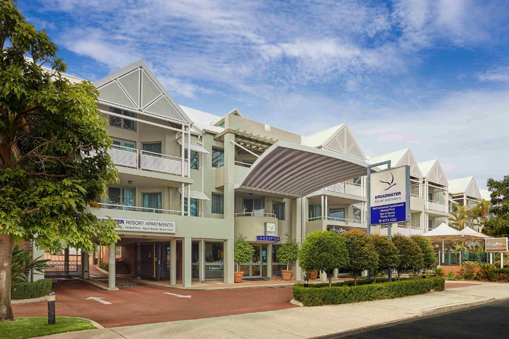 a large apartment building on a street at Broadwater Resort Como in Perth