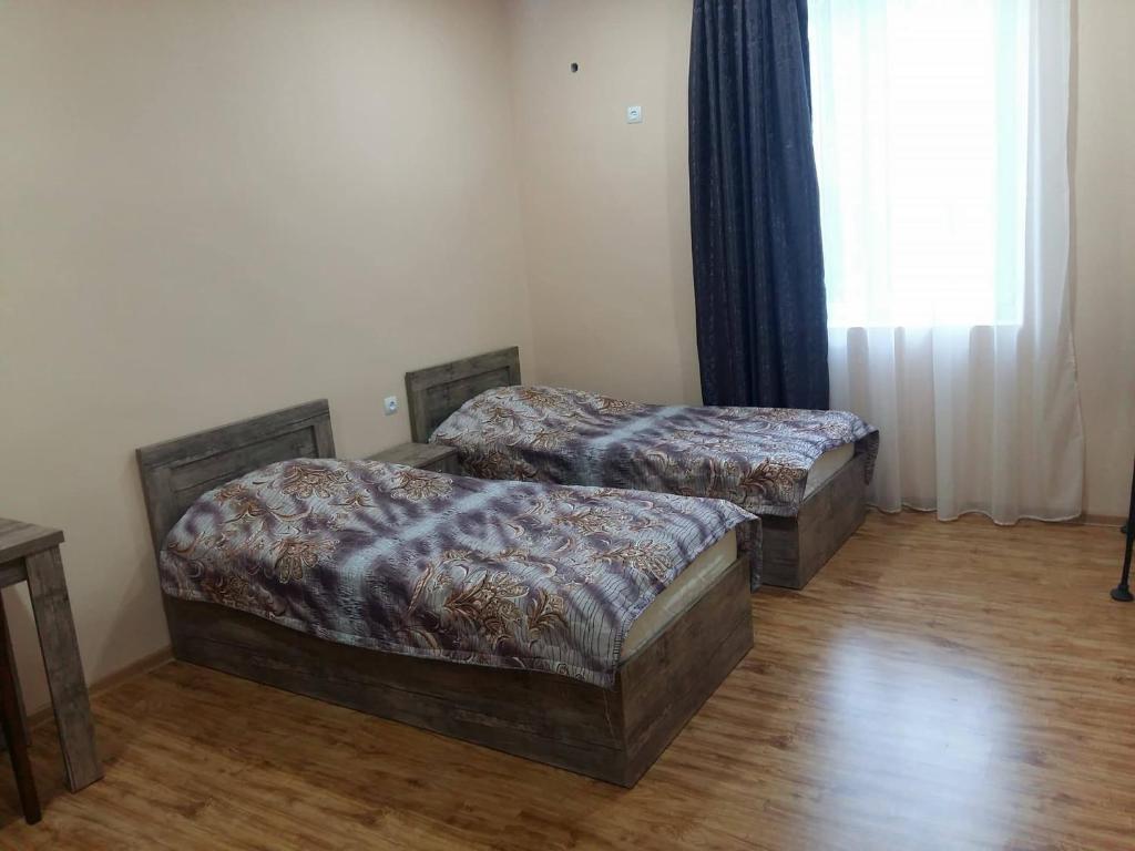 Postel nebo postele na pokoji v ubytování Luiza Lomidze