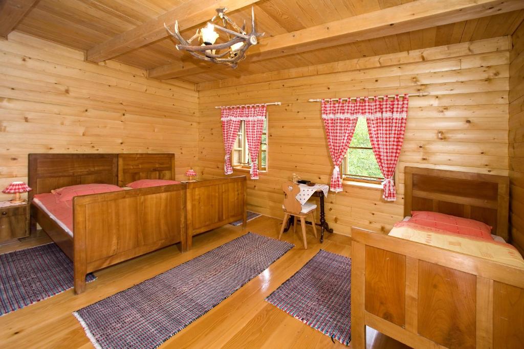 Postel nebo postele na pokoji v ubytování Holiday House Sobol