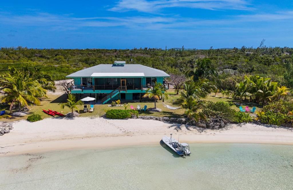 an aerial view of a house on the beach at Villa Blue Hole in Mangrove Cay