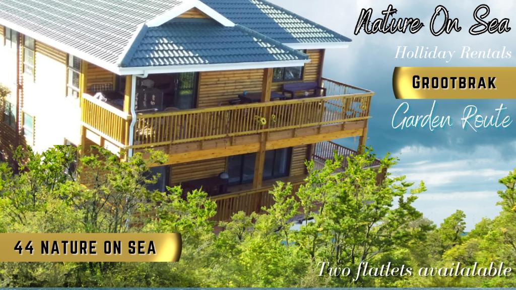 een foto van een huis met een balkon bij 44 Nature On Sea in Groot Brak Rivier