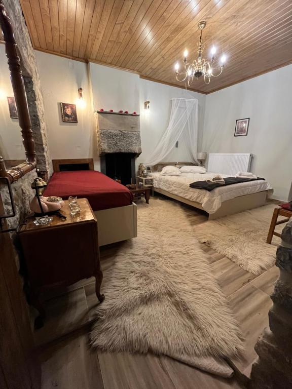 Postel nebo postele na pokoji v ubytování Kostaki's Stonehouse 2