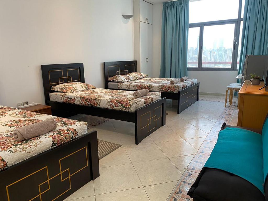 Svetainės erdvė apgyvendinimo įstaigoje J & F Homestay - Abu Dhabi