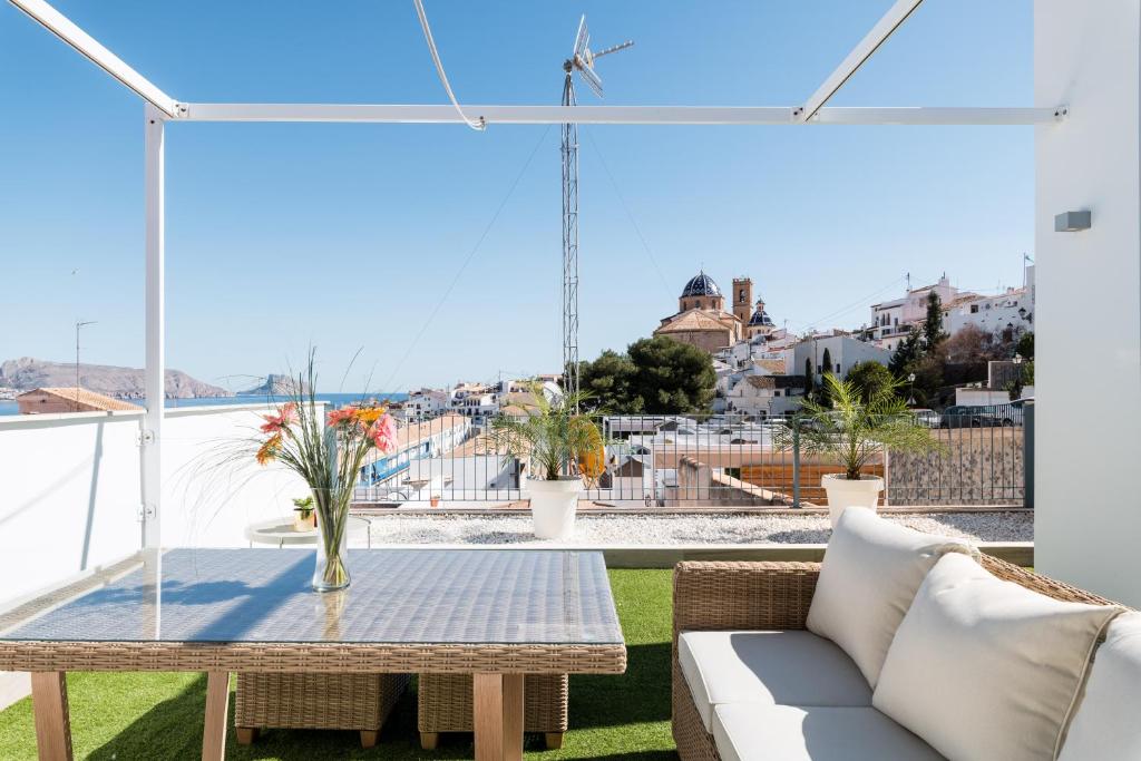 a balcony with a table and a view of the city at Atico Altea17 by Vero in Altea