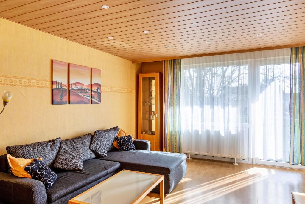a living room with a couch and a large window at Haus Zum Rochusberg 2 in Bingen am Rhein