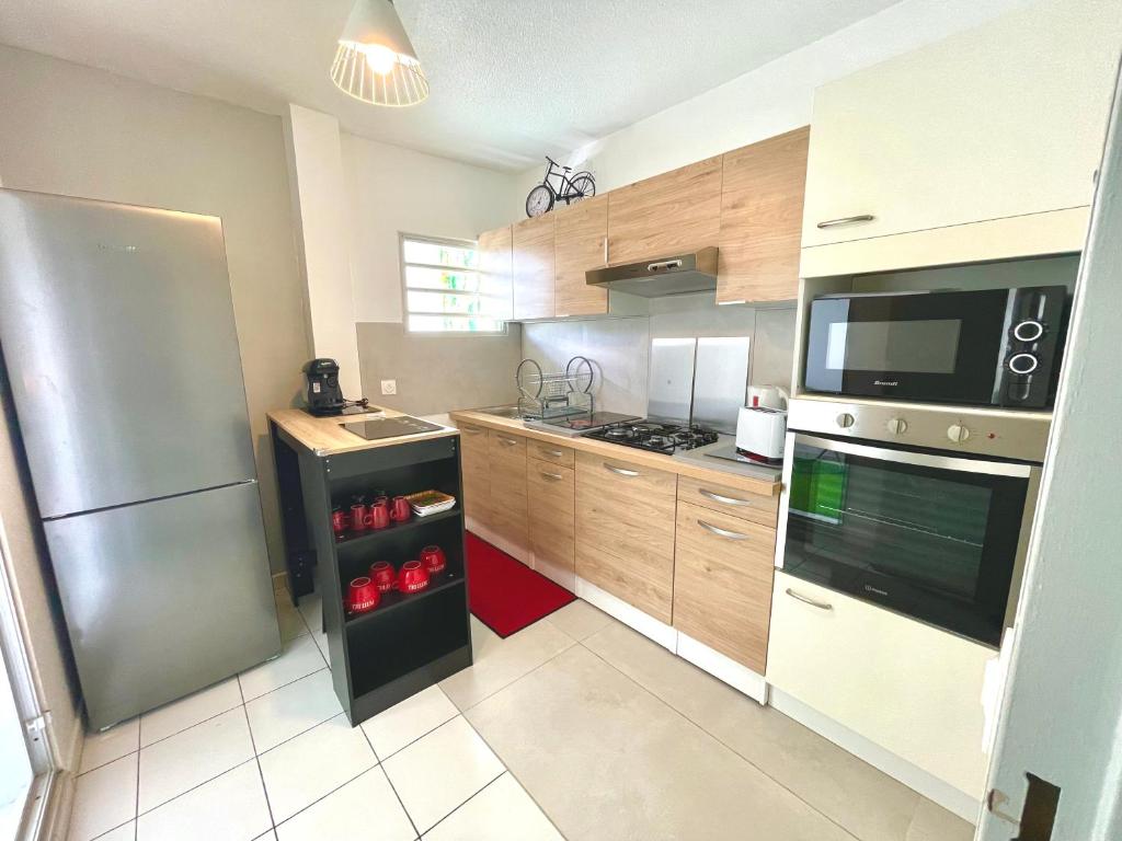 Kuchyň nebo kuchyňský kout v ubytování Appartement de la Mer et du Levant