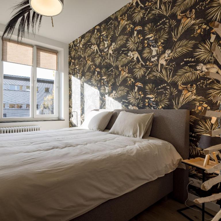 Postel nebo postele na pokoji v ubytování Gîtes in Huy - Appartements chaleureux dans le centre de Huy