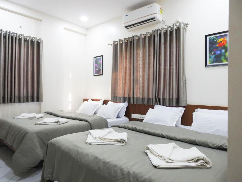 Krevet ili kreveti u jedinici u objektu Hotel Sai Sneha