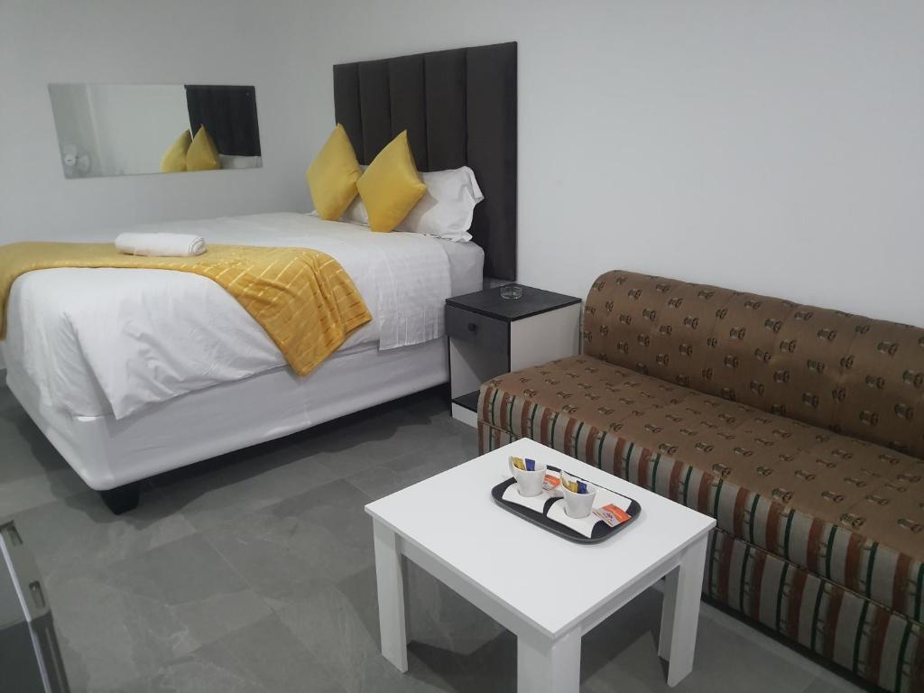 Posteľ alebo postele v izbe v ubytovaní De Bliss Lodge