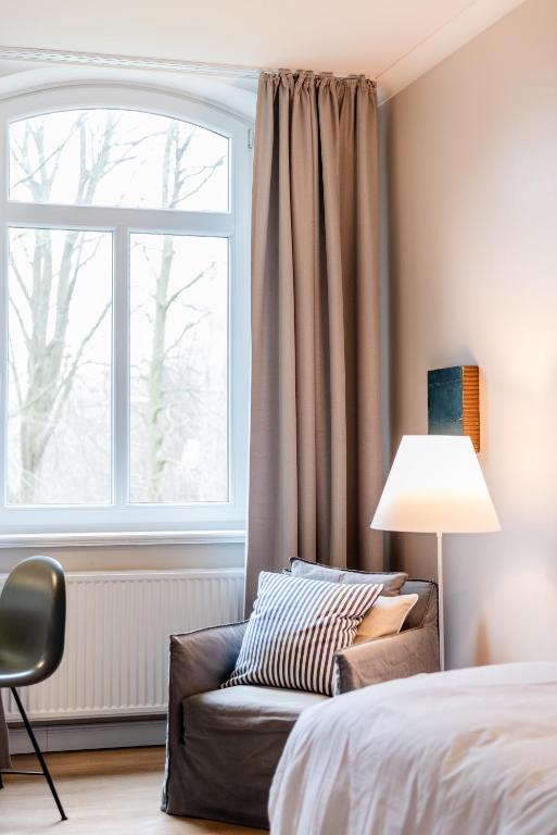 Postel nebo postele na pokoji v ubytování Aarskogs Boutique Hotel