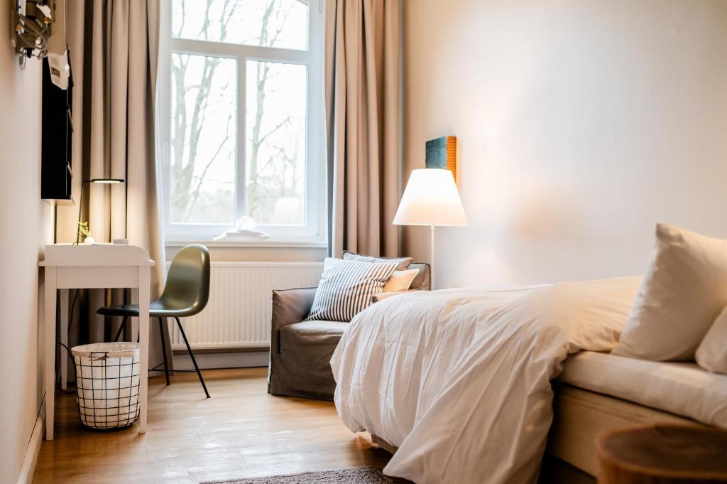 Postel nebo postele na pokoji v ubytování Aarskogs Boutique Hotel