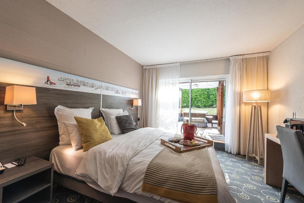 Postel nebo postele na pokoji v ubytování Mercure Annecy Sud